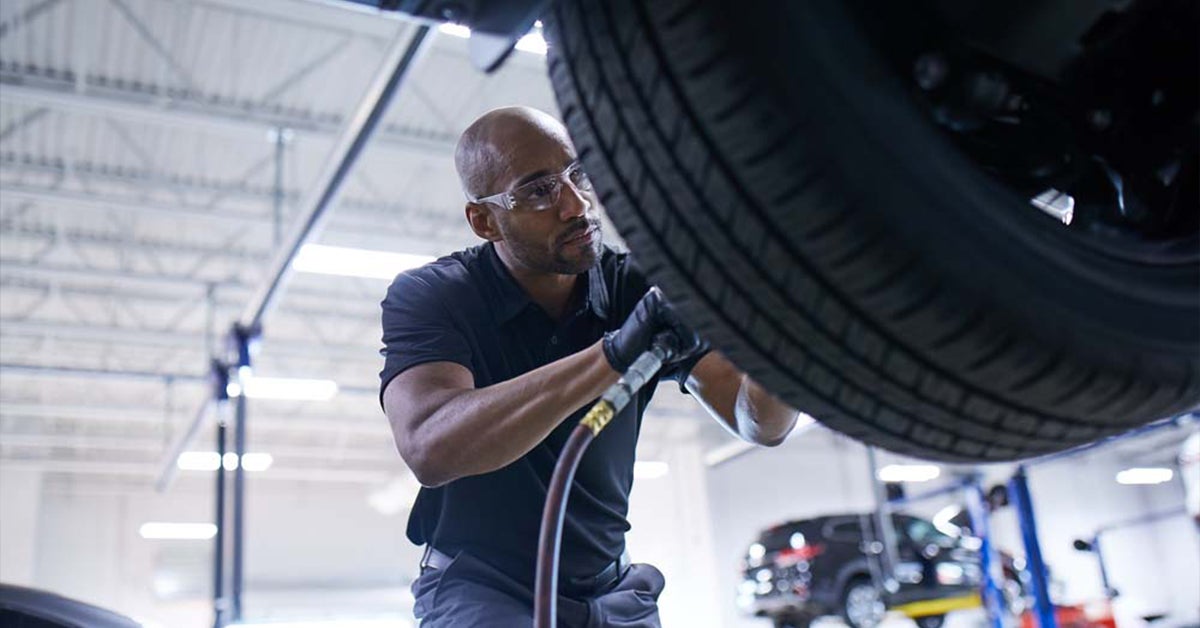495 Mazda wheel rotation service being done on a vehicle.